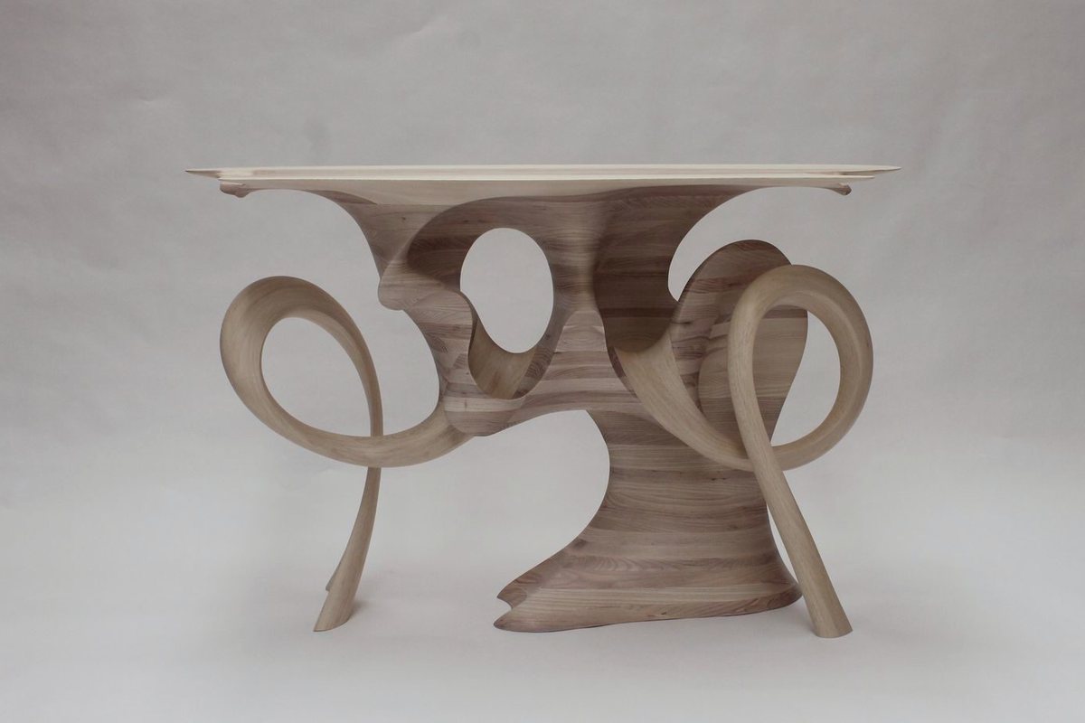 Aeolian — an ash console carried on interlocking carved loops