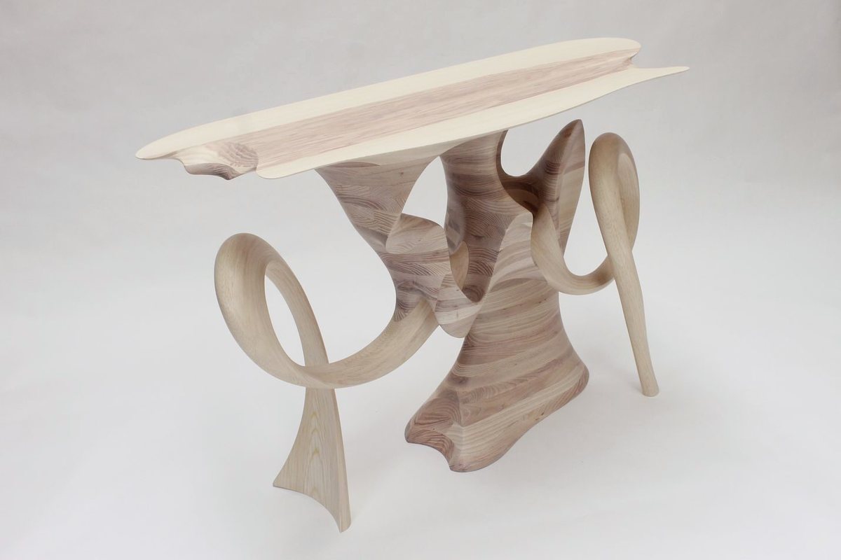 Aeolian — an ash console carried on interlocking carved loops