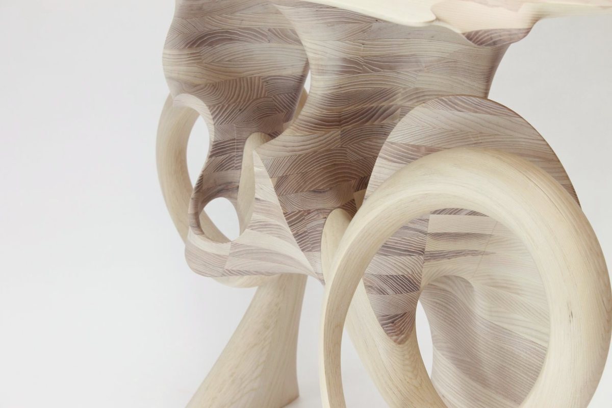 Aeolian — an ash console carried on interlocking carved loops
