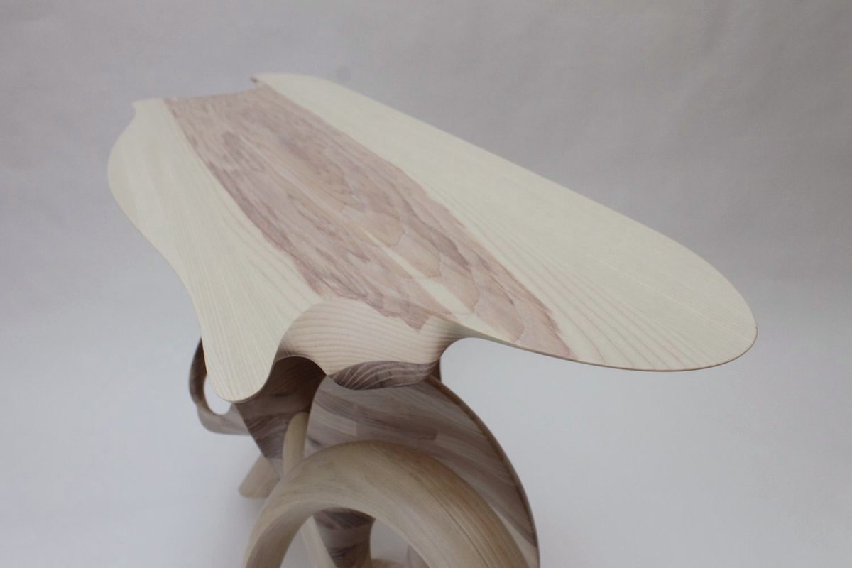 Aeolian — an ash console carried on interlocking carved loops