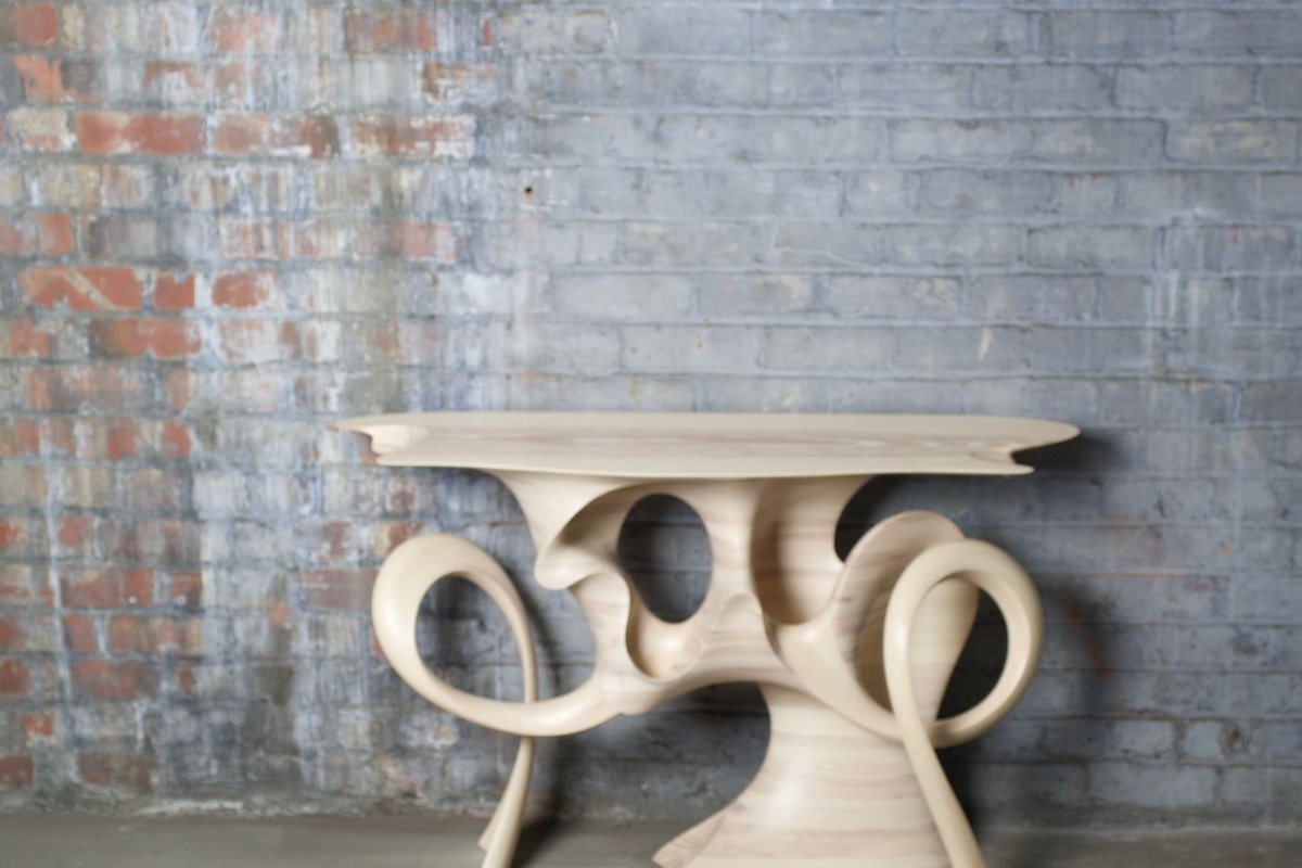 Ash Console — a base of carved interlocking rings