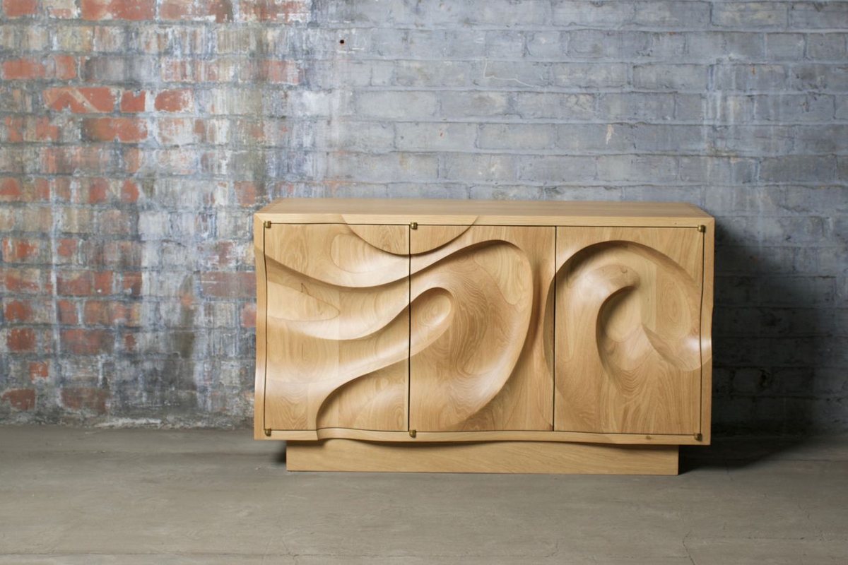 Waves — an oak cabinet carved in a deep wave relief