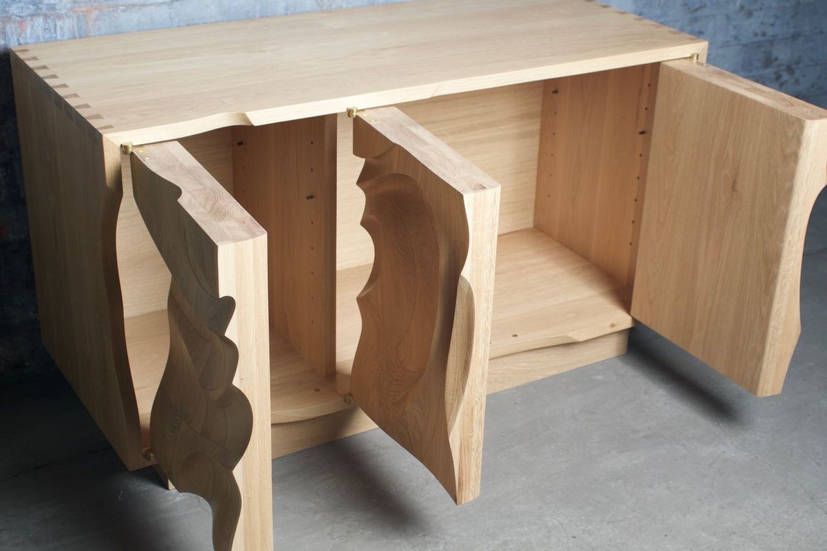 Waves — an oak cabinet carved in a deep wave relief