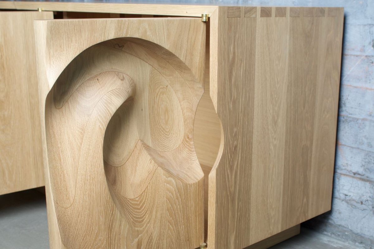 Waves — an oak cabinet carved in a deep wave relief