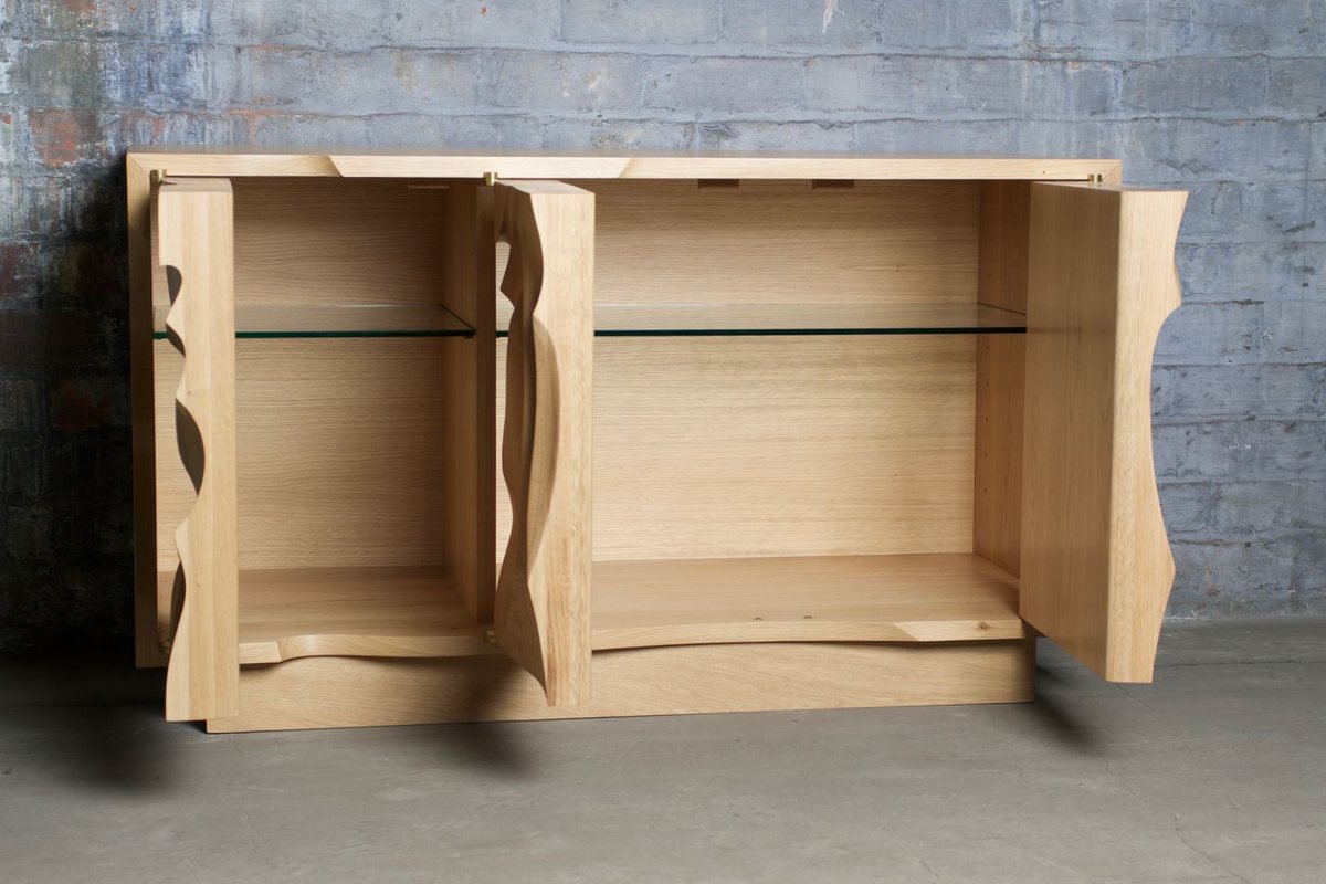 Waves — an oak cabinet carved in a deep wave relief