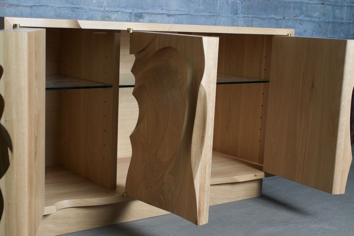 Waves — an oak cabinet carved in a deep wave relief