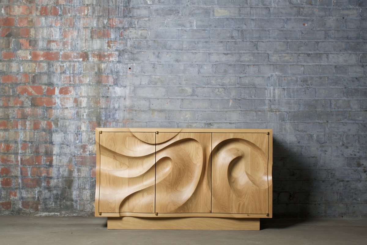 Waves — an oak cabinet carved in a deep wave relief
