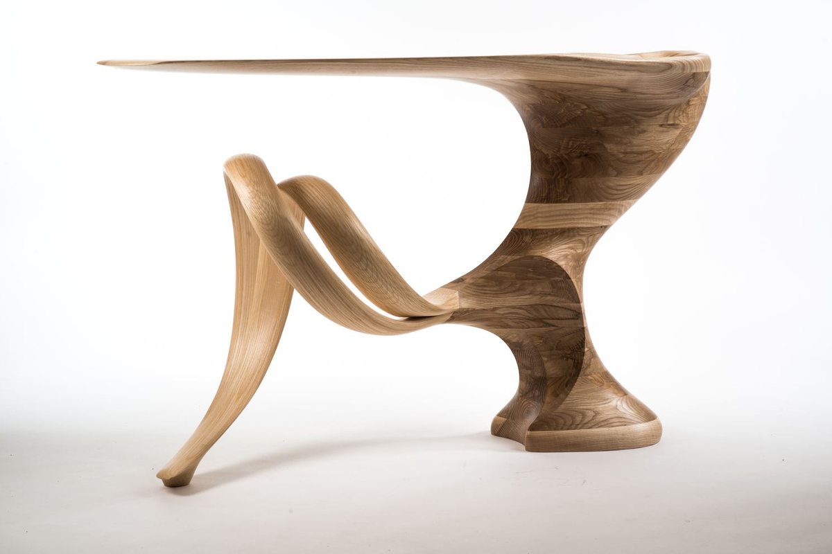 Roxanne — a console with a lobed top on a carved pedestal