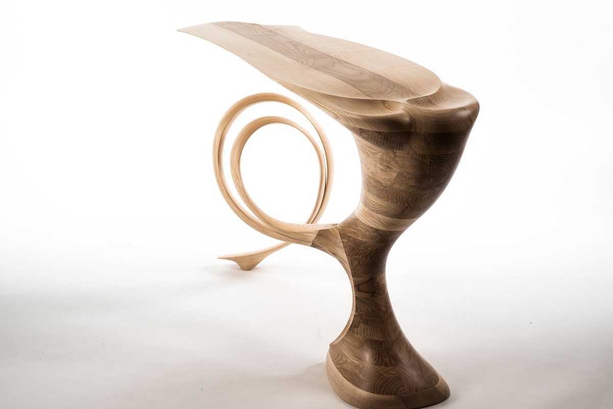 Roxanne — a console with a lobed top on a carved pedestal