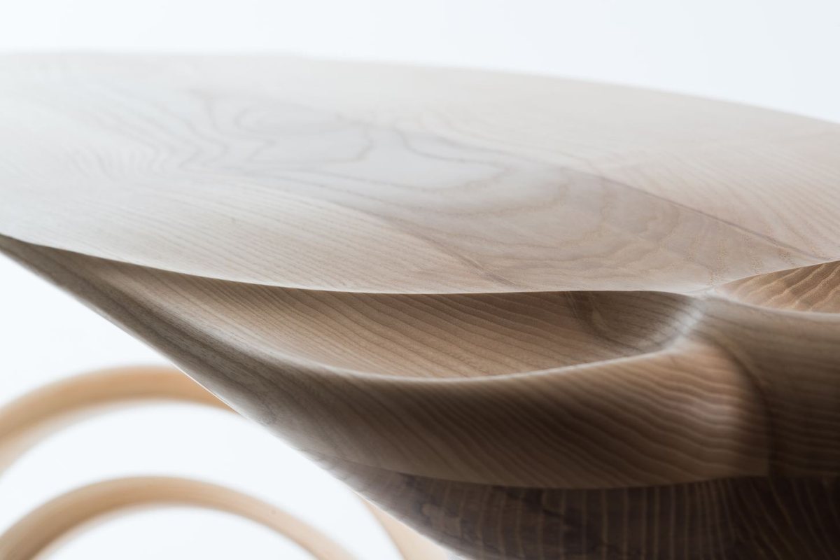 Roxanne — a console with a lobed top on a carved pedestal