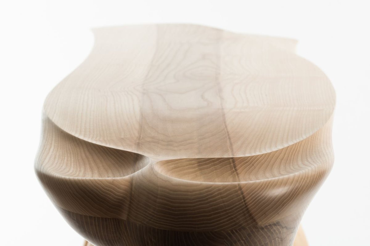 Roxanne — a console with a lobed top on a carved pedestal