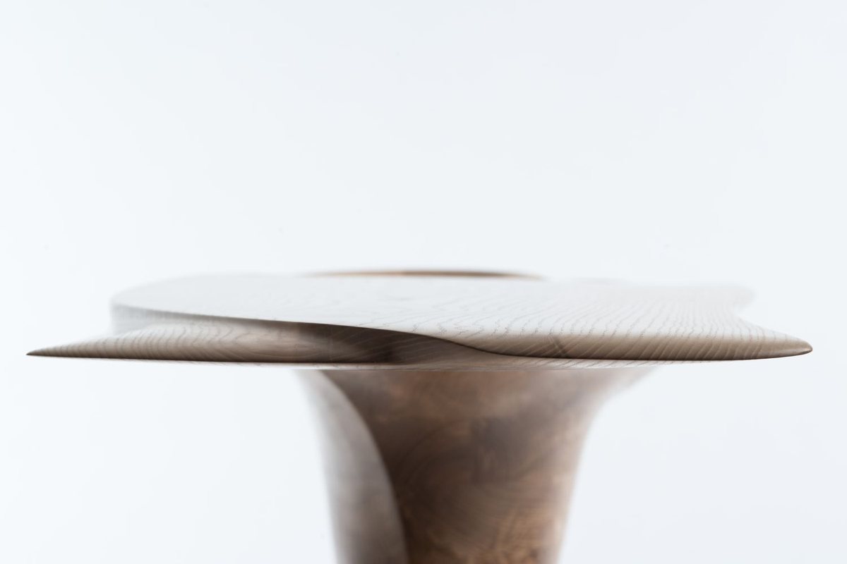 Roxanne — a console with a lobed top on a carved pedestal