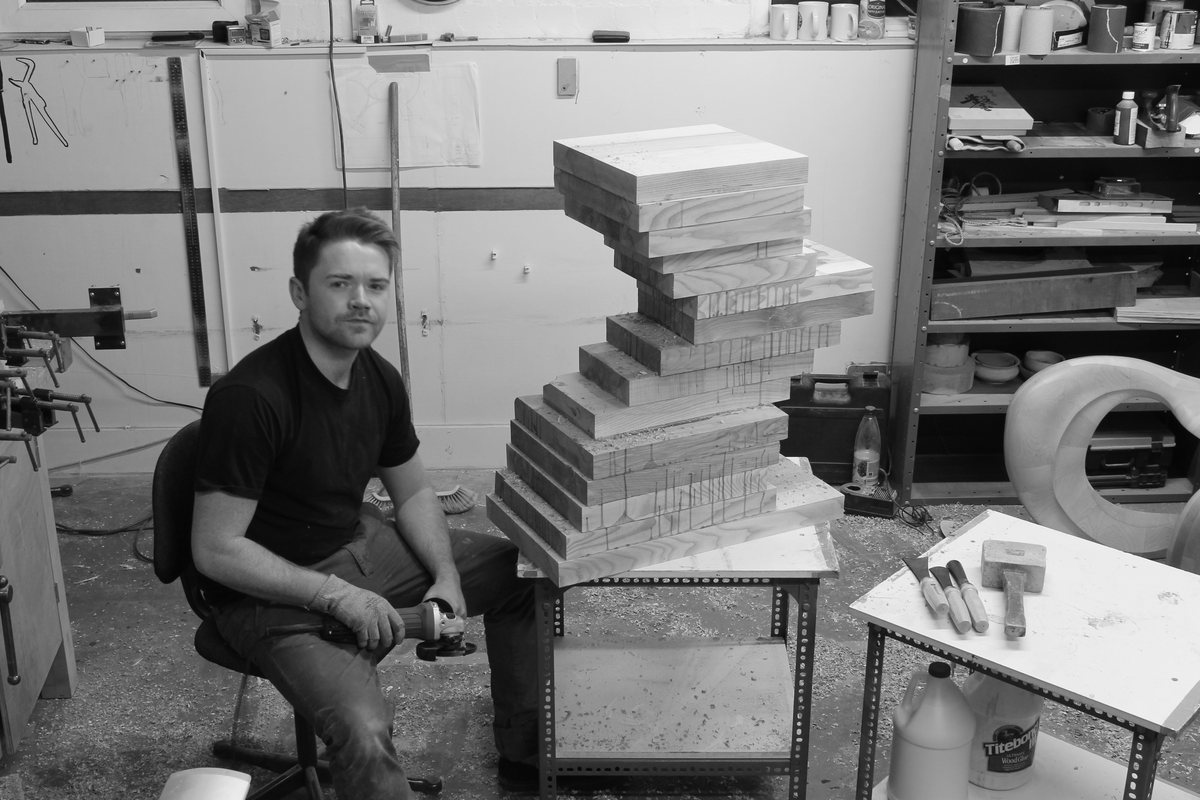 Work under way — hands, tools and timber