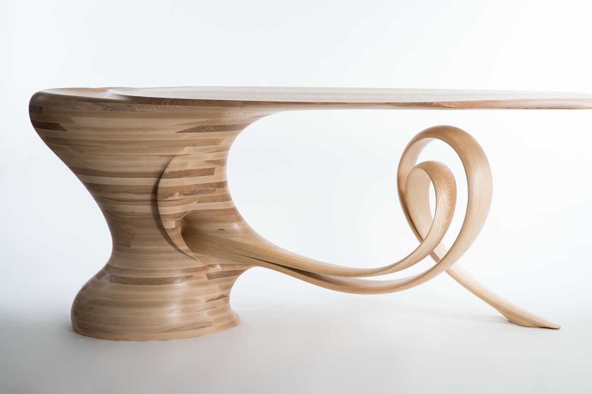 Waiho — a console table in ash, its top carried above a curling ribbon leg