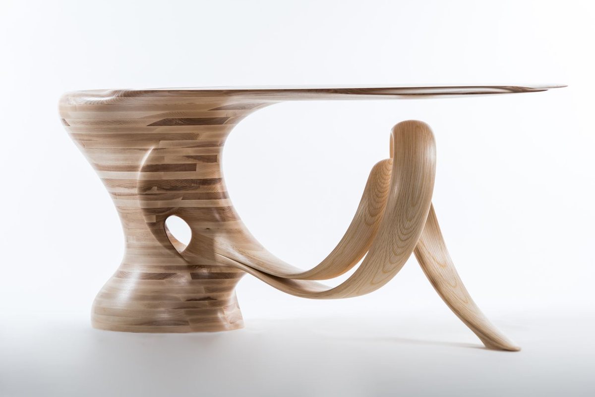 Waiho — a console table in ash, its top carried above a curling ribbon leg
