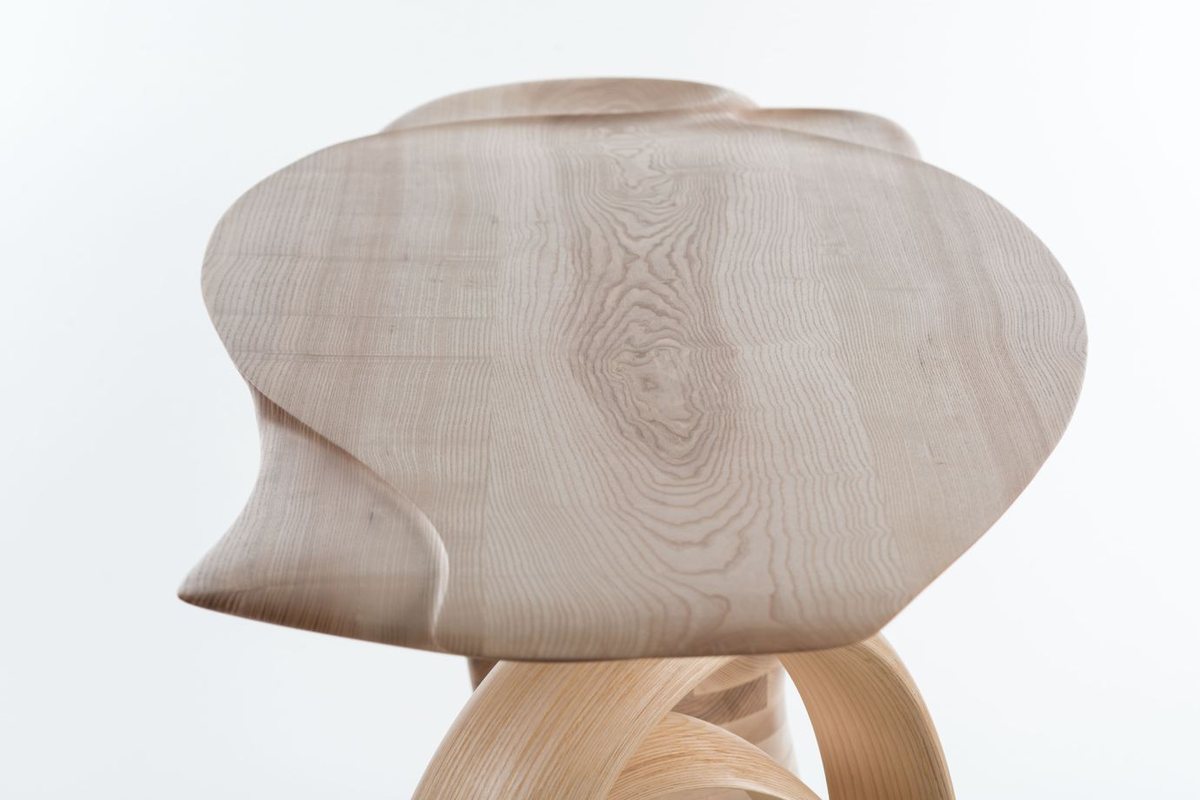 Waiho — a console table in ash, its top carried above a curling ribbon leg