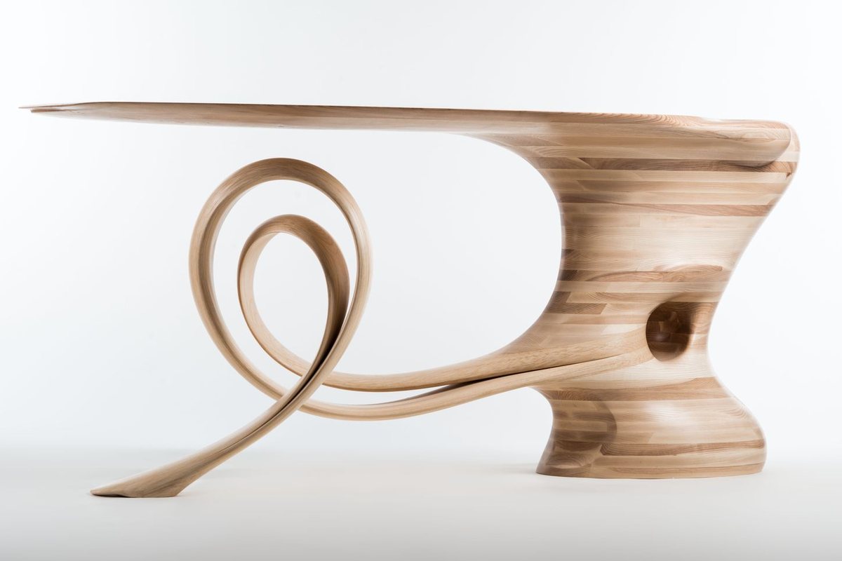 Waiho — a console table in ash, its top carried above a curling ribbon leg