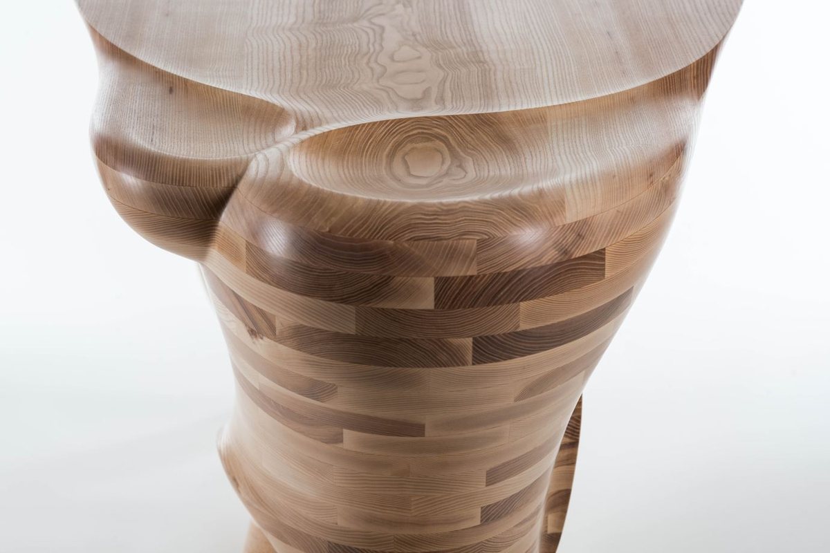 Waiho — a console table in ash, its top carried above a curling ribbon leg