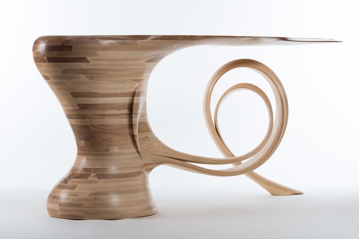 Waiho — a console table in ash, its top carried above a curling ribbon leg